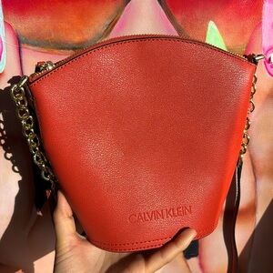 Calvin Klein burnt red-orange crossbody bag with gold chain